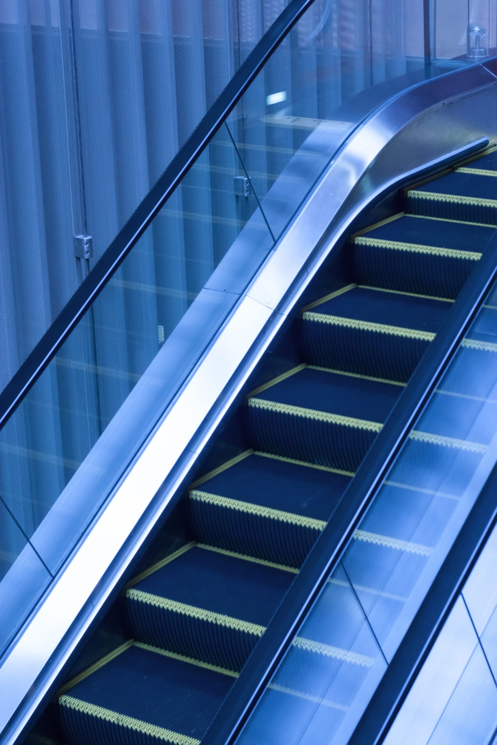 escalators inside office building scaled